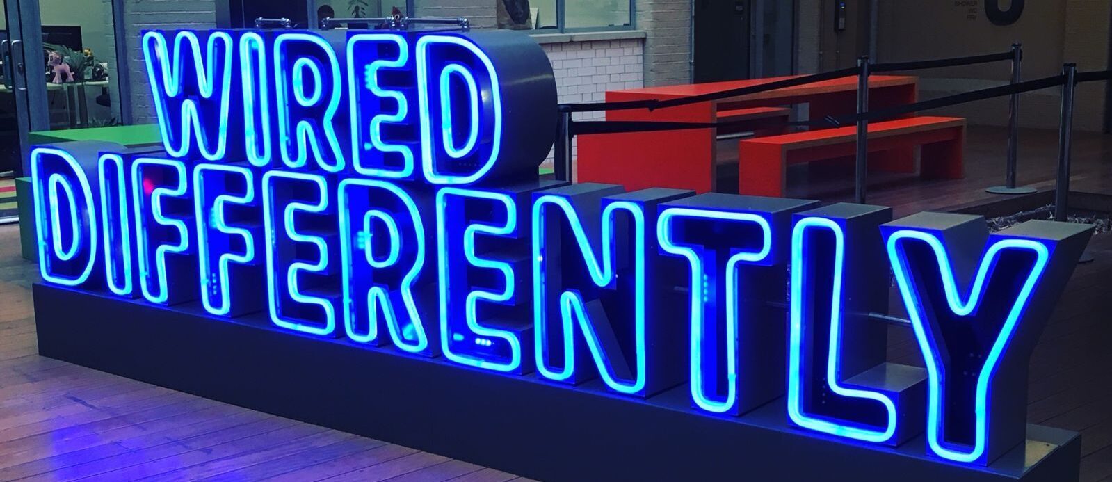 A neon sign that reads: "Wired differently"